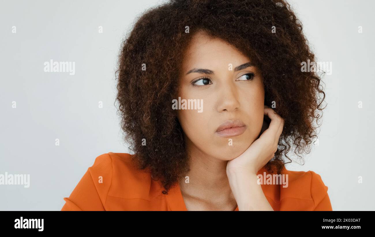 Sad worried African woman ponder thinking problem feeling anxiety depression upset frustrated lonely curly haired pensive girl lady grief troubled Stock Photo