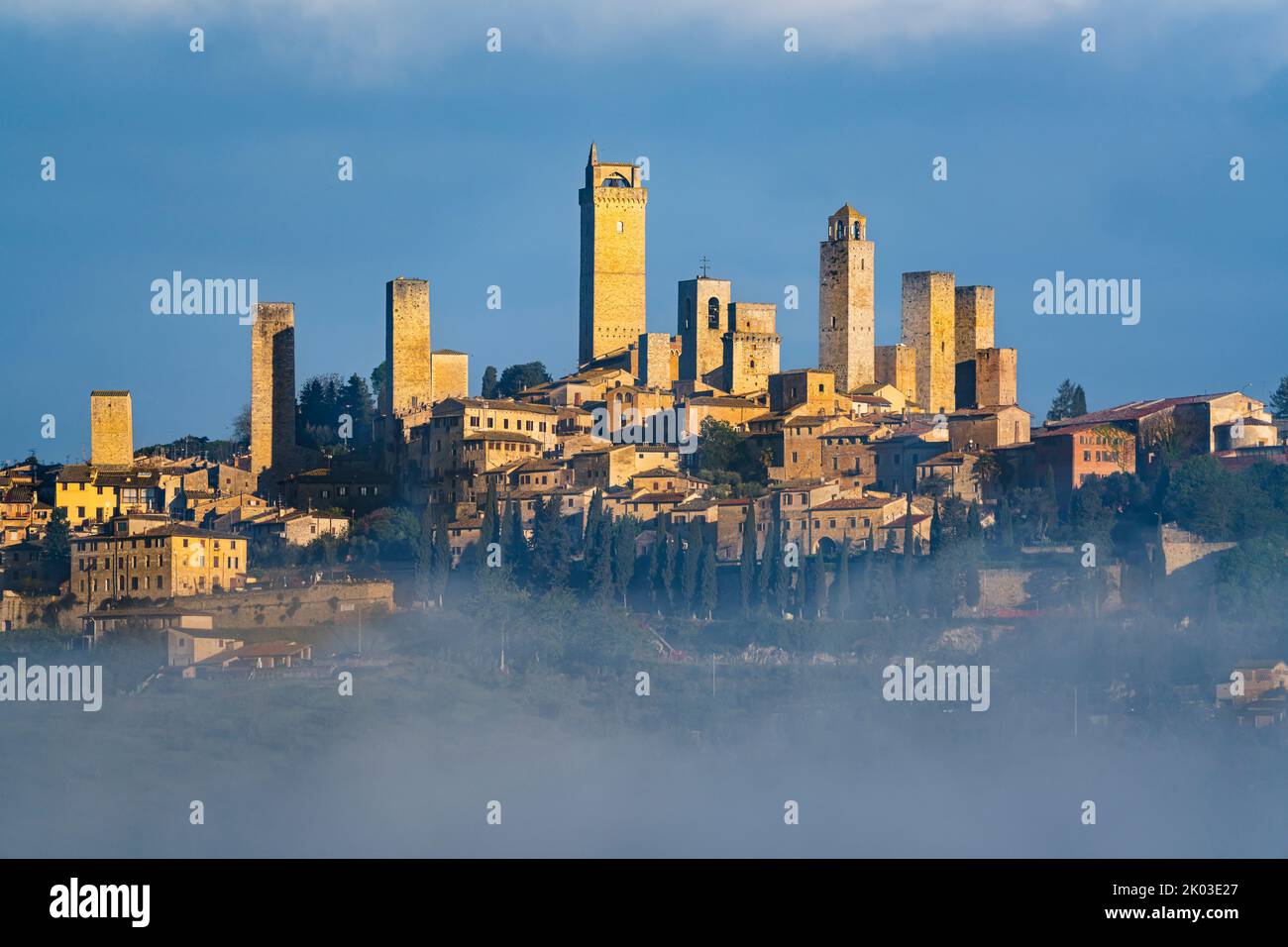San Gimignano in the fog, Siena, Tuscany, Italy Stock Photo