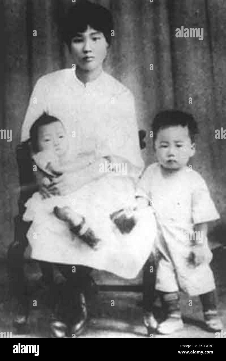 Yang Kaihui he her sons: Mao Anqing and Mao Anying. Yang Kaihui (1901 - 1930) was the second wife of Mao Zedong, whom he married in 1920. She had three children with Mao Zedong: Mao Anying, Mao Anqing, and Mao Anlong. Stock Photo