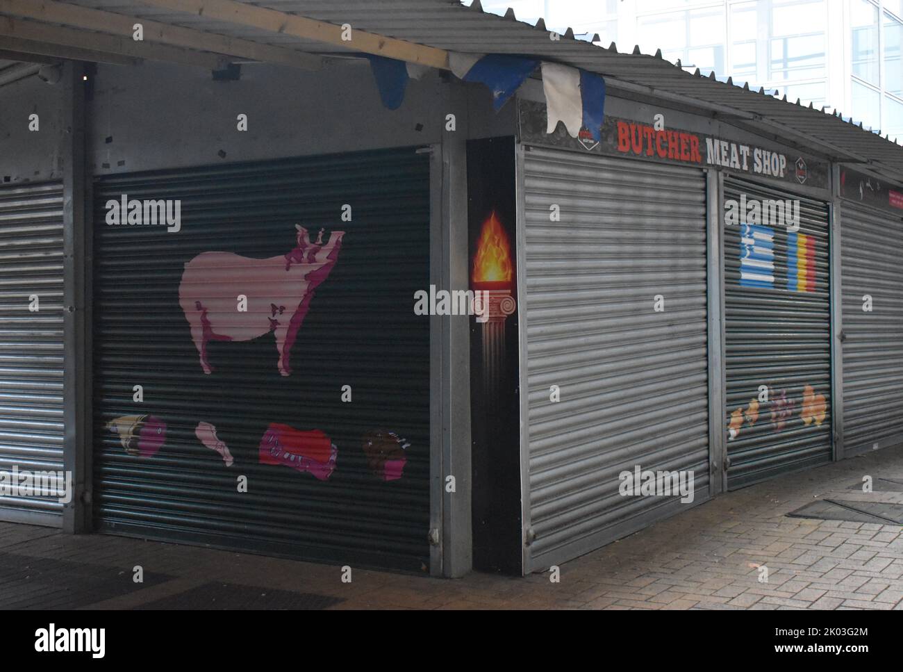 Colourful painted shutter on a stall in Milton Keynes open air market, showing that it is a butcher's. Stock Photo