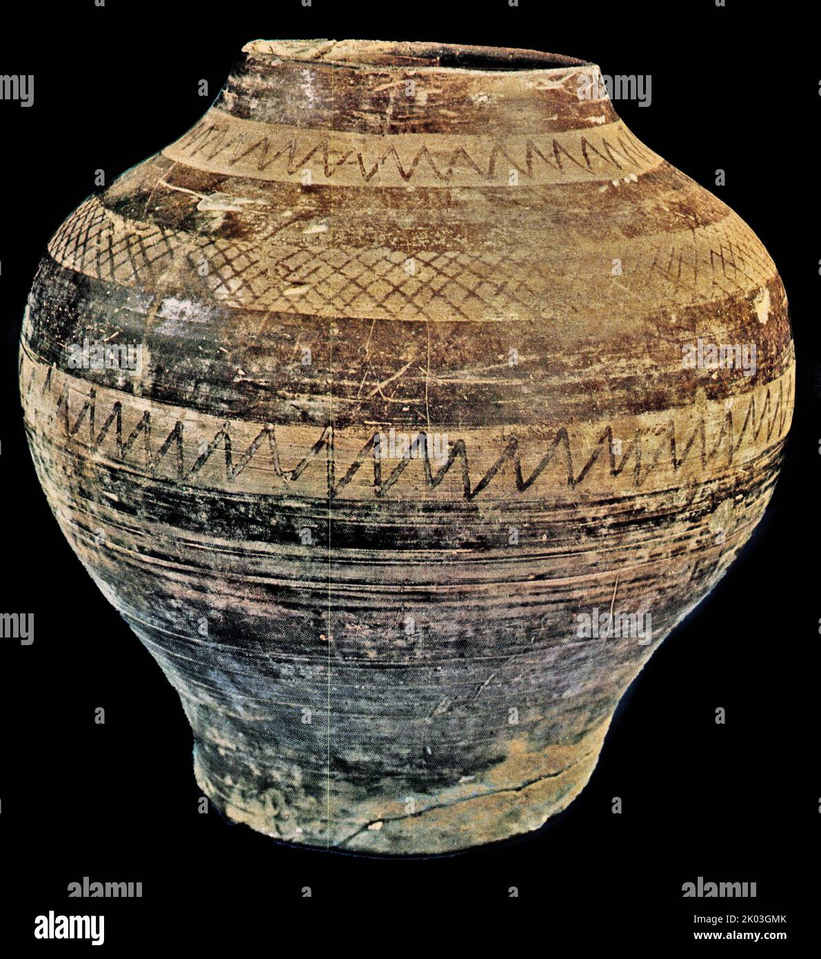 Warring States Period pottery excavated at Guangwu area, Henan Province in 1928. The soil of the pottery is firm and fine and dark in colour. The pottery has a flat mouth, broad shoulders, a large belly, and a flat bottom. It is painted with smooth hard stones or other similar tools, and the painted places show the smooth nature of clay. This method was commonly used by those who made black pottery at that time. Stock Photo