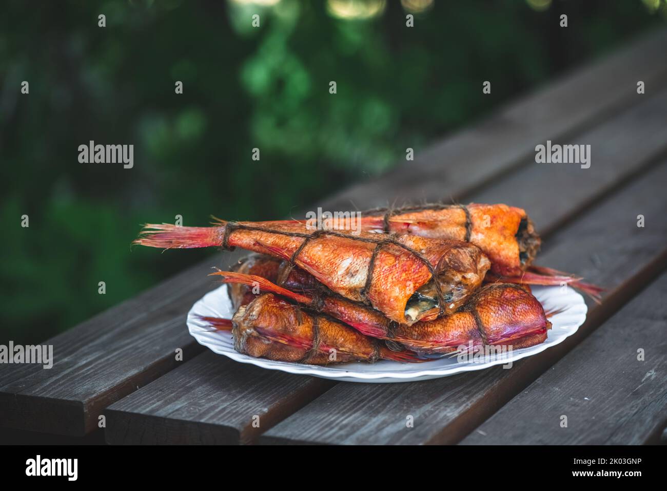 smoked fish sea bass on the table. homemade smoking Stock Photo Alamy