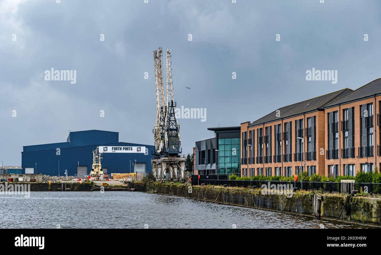 Disused cranes and The Big Blue Shed at Forth Ports, Leith harbour, Edinburgh, Scotland, UK Stock Photo