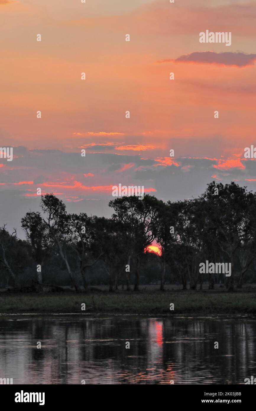 172 Red sundown over Yellow Water-Nugurrungurrudjba Billabong with paperbark trees. Kakadu-Australia. Stock Photo