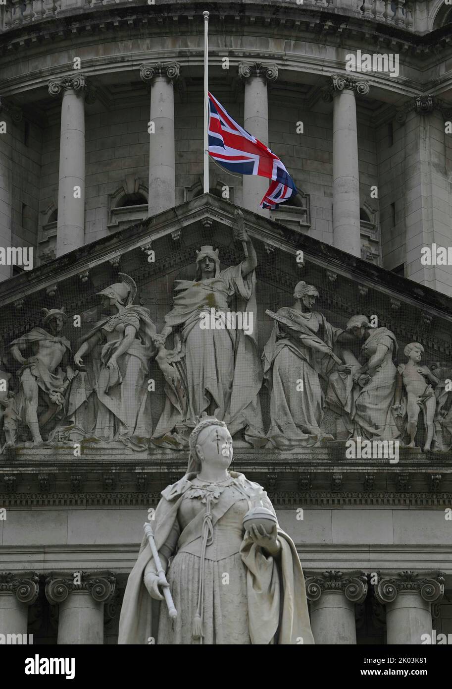 The Union flag flies at halfmast above Belfast City Hall following the