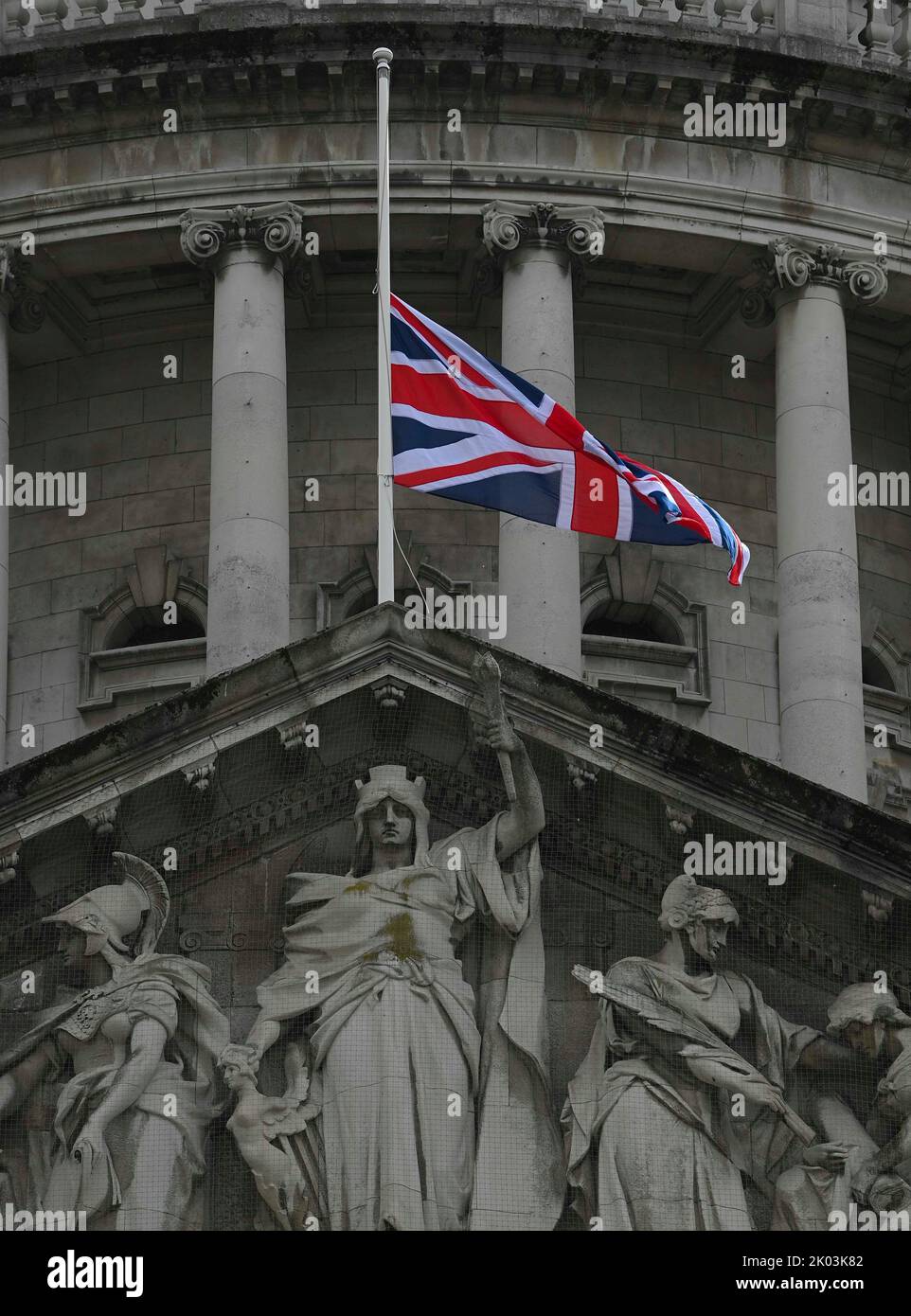 The Union flag flies at halfmast above Belfast City Hall following the