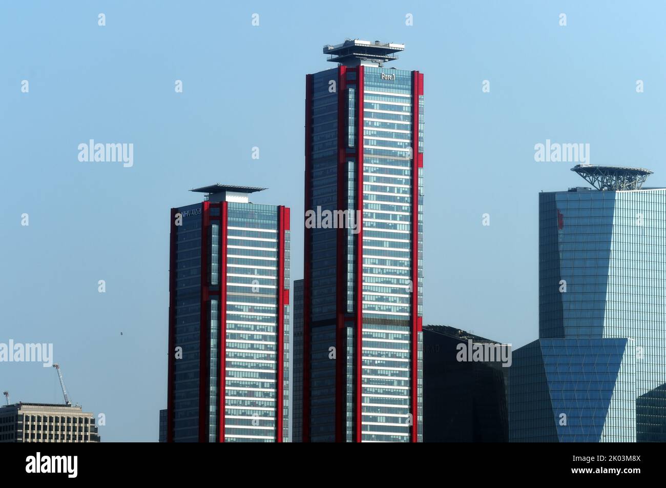 The Parc 1 Tower (with red piping), is a supertall skyscraper in Seoul, South Korea. It stands 333 m (1,093 ft) and contain 69 floors. Construction stopped in 2011 but resumed in early 2017. Yeouido Han River Park, in Seoul, South Korea Stock Photo