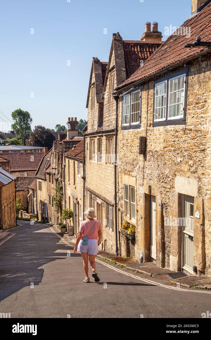 Woman walking down Coppice Hill in the Wiltshire market town of Bradford on Avon Stock Photo