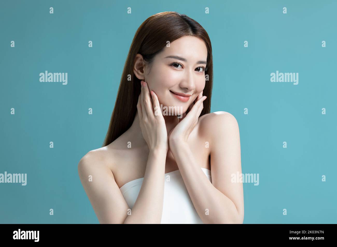 Studio shot of beautiful young Chinese woman Stock Photo - Alamy