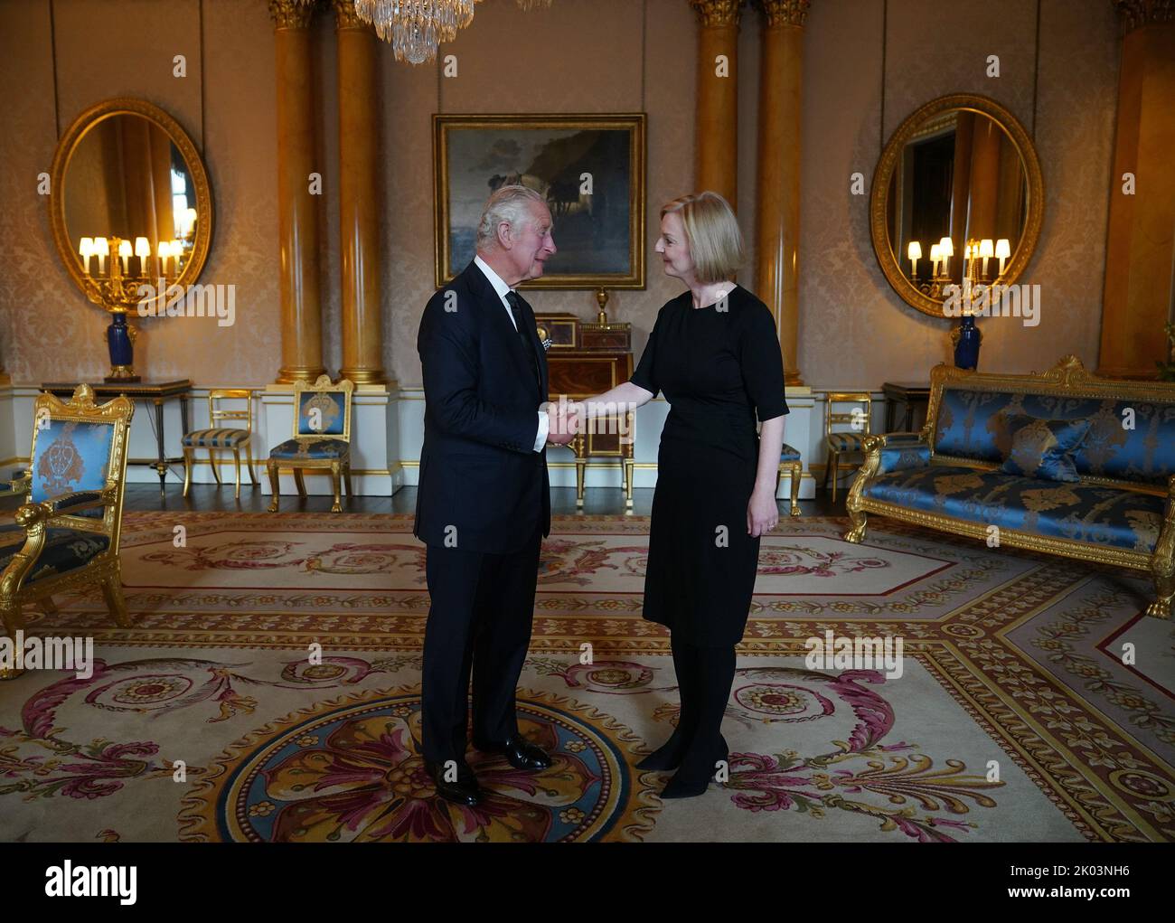 King Charles III shakes hands with Prime Minister Liz Truss during(01)