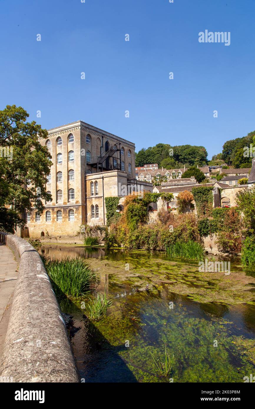 The River Avon as it flows through the Wiltshire market town of Bradford on Avon with the old Abbey mill on the far river bank Stock Photo
