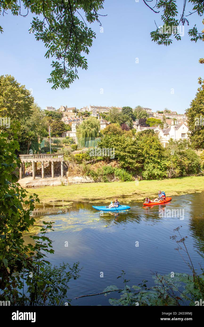Children in a canoe Kayak on the river Avon passing through the Wiltshire market town of Bradford on Avon  Wiltshire England Stock Photo