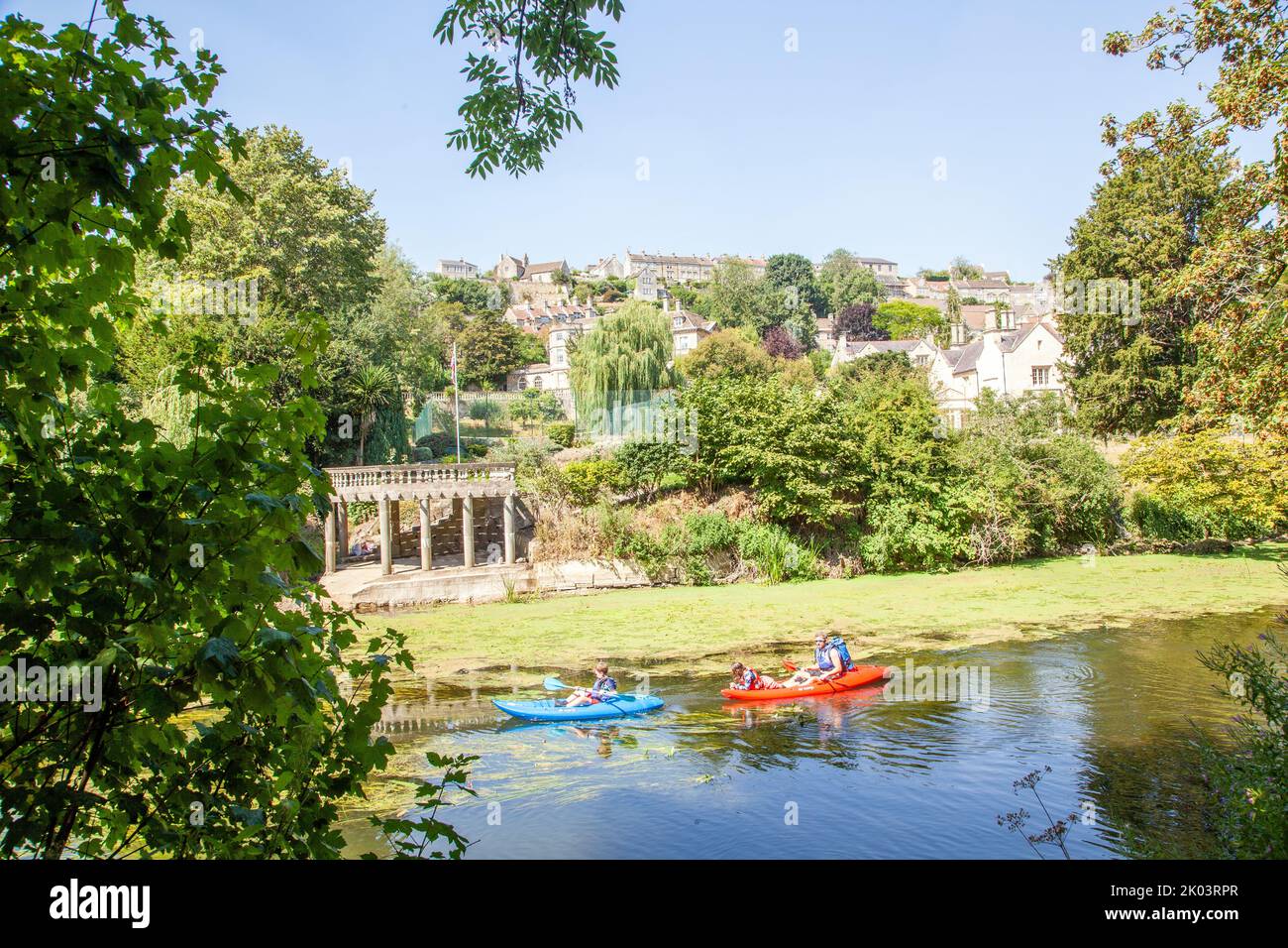 Children in a canoe Kayak on the river Avon passing through the Wiltshire market town of Bradford on Avon  Wiltshire England Stock Photo