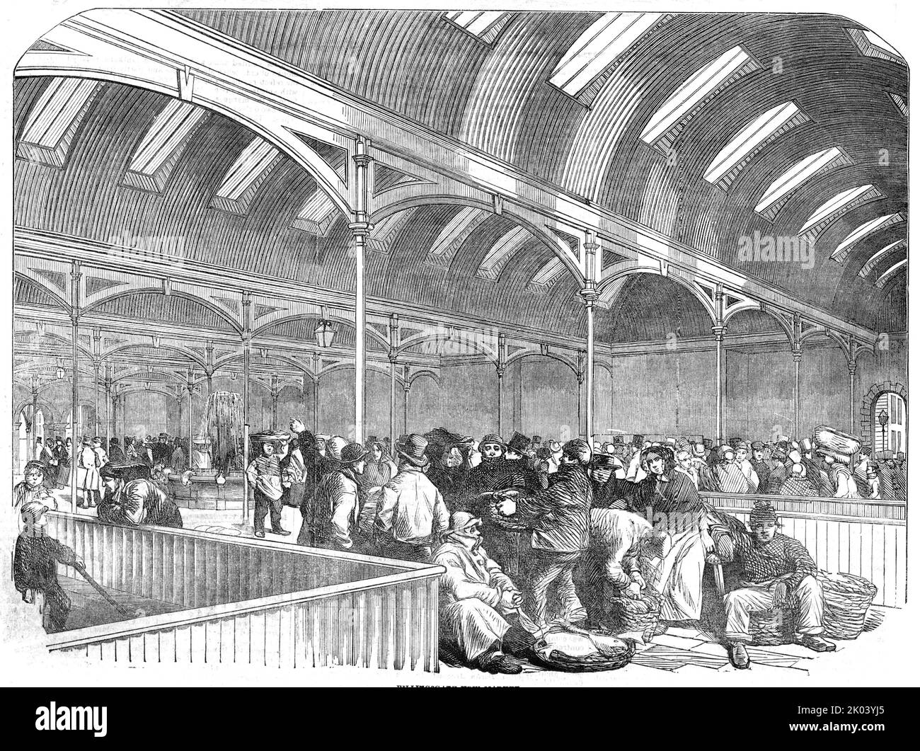 Billingsgate New Market [in London], 1854. 'The New Market is covered with semicircular roofs of galvanised corrugated iron, supported on light iron columns and girders...a glass roof also runs from north to south...A plentiful supply of water is insured...by means of a fountain...which is ornamented with figures of dolphins, from whose mouths water is continually flowing. For the purpose of cleansing, and assisting in the ventilation both of the Upper and Lower Markets, a continual flow of water is supplied through a series of iron gutters in the pavement, covered with trellis gratings, the w Stock Photo