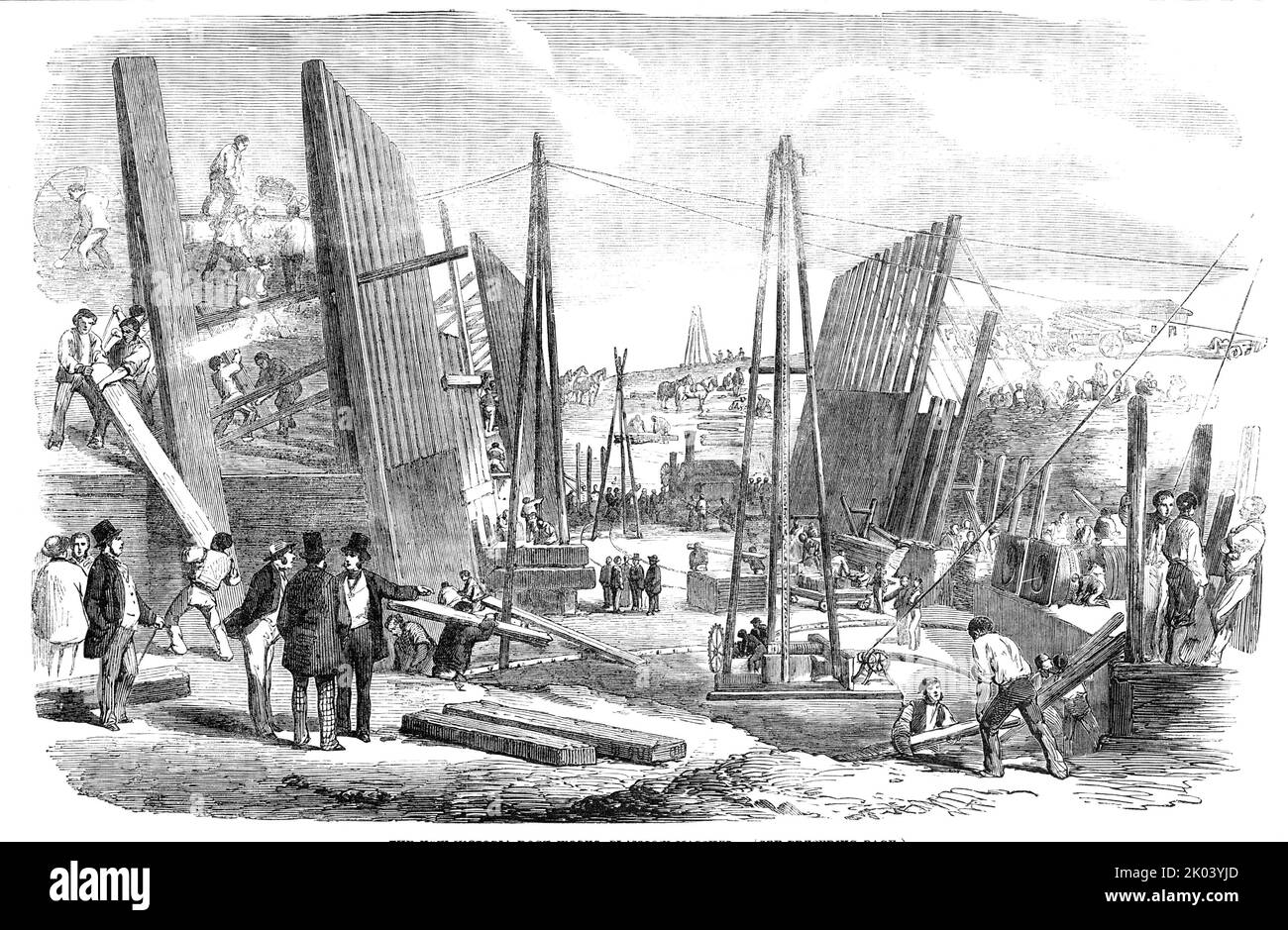 The New Victoria Dock Works, Plaistow Marshes, 1854. Expansion of the River Thames' shipping trade capacity by Peto, Brassey and Betts. The docks adjoin '...the North Woolwich Railway; by which they will have ready access to the heart of the City, and be placed in direct communication with all the great railways in the kingdom...The Western Dock and Tidal Basin will afford, together, an area of water accommodation of ninety acres, and upwards of a mile of Quay and Wharfage-room, together with 160,000 feet of fire-proof Warehouses, on a single floor, adapted for the reception of every descripti Stock Photo