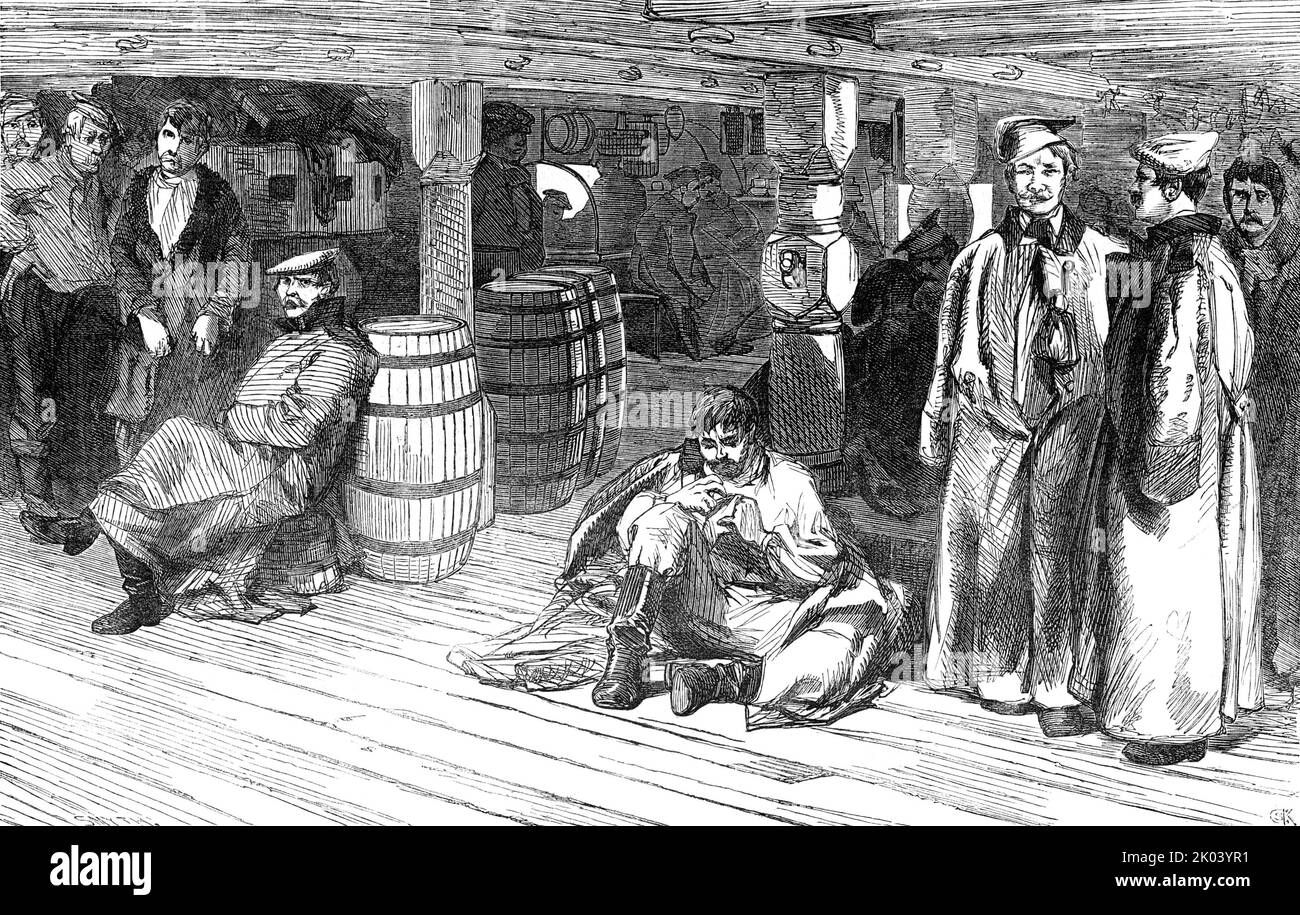 '&quot;The Devonshire&quot; - Russian Prisoners between Decks, 1854. Prisoners of the Crimean War held on prison hulks on the River Medway in Kent. 'There are now 1140 Russian prisoners on board the Devonshire and Benbow...The officers are stout-built, powerful men; but the soldiers have that thin lathy appearance which is seen in the inmates of our workhouses and prisons...truth compels us to state that there is an evident want of cleanliness among them. Making, however, every allowance, the Russian soldier, in his long grey pepper-and-salt great-coat, with faded facings, and no brass ornamen Stock Photo