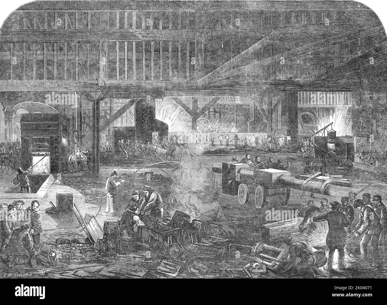 Mare and Co.'s Iron Ship-Building Works, 1854. Shipyard on the River Thames in London during the Crimean War, an '... industrial army of between 3000 and 4000 hands, busily engaged in the construction of vessels, not only to meet the exigencies of the war, but also the demands of our increased trade...It is almost bewildering to pass amongst the numerous punching and shearing machines, moved by steam power, cutting and piercing thick iron as readily as if it were writing paper...In this yard some of the most powerful machinery is in motion: numerous furnaces are in active operation, heating an Stock Photo