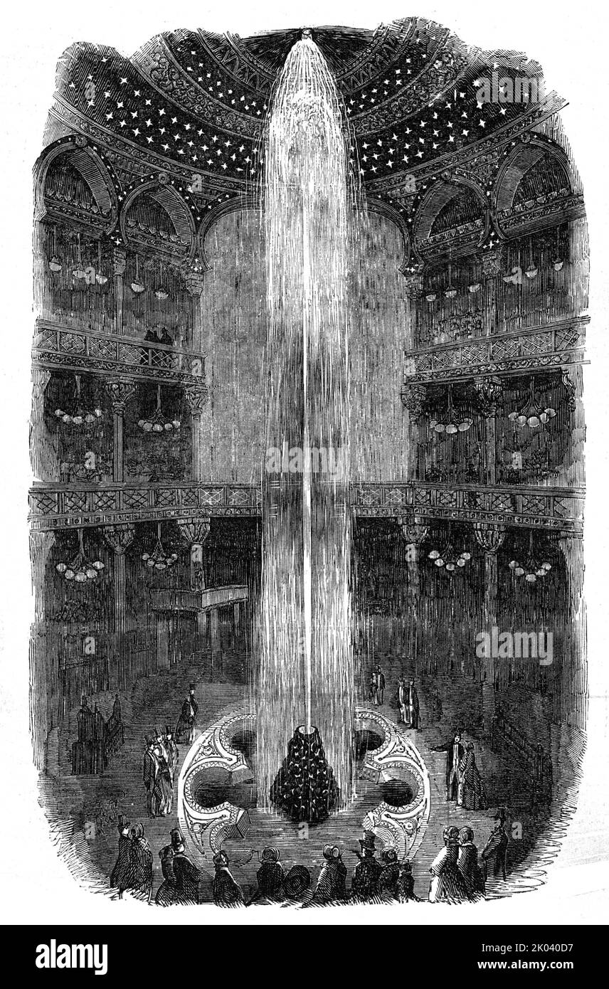 The Luminous Fountain, at the Panopticon, Leicester-Square, 1854. 'Thousands of sight-seers have already seen the magnificent Fountain at the Royal Panopticon, with its central jet leaping from an enamelled base to a height of ninety-nine feet. The sight of this extraordinary column of water subjected to a powerful light, so as to exhibit a variety of the most brilliant hues, will surprise the spectator...A strongly concentrated and reflected light at each end of the Jet illuminates the whole length, effectually colouring, as well as making brilliant the up-springing shaft, with the detached p Stock Photo
