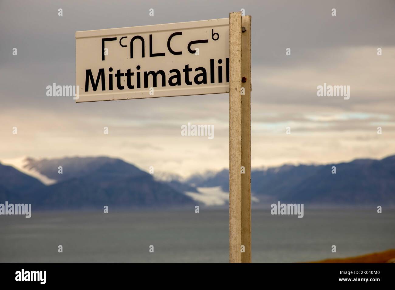 Street sign in english and Inuit language at Pond Inlet on Eclipse Sound, Baffin Island, Nunavut, Canada. Stock Photo