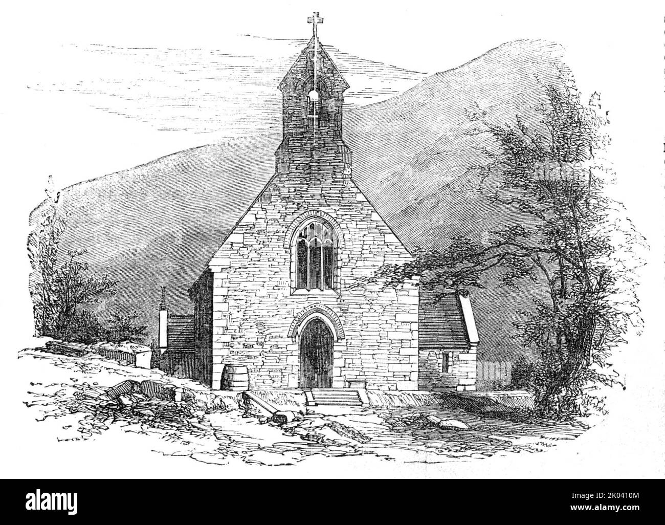 New Church, built by Sir Benjamin Hall, at Abercarn, South Wales, 1854. Church provided '...for the sole use of the native Cymri...The edifice is built of the fine stone of the locality...The sculpture of the stone corbels and mullions of the windows is very fine, but devoid of all fantastic ornaments...the style is the simple, solid architecture of the oldest ecclesiastical edifices in Wales, with a belfry, but no tower...The whole proceedings were arranged with the strictest attention to the benefit of the Welsh people, by the establishment of a commodious Church, where they can be certain o Stock Photo