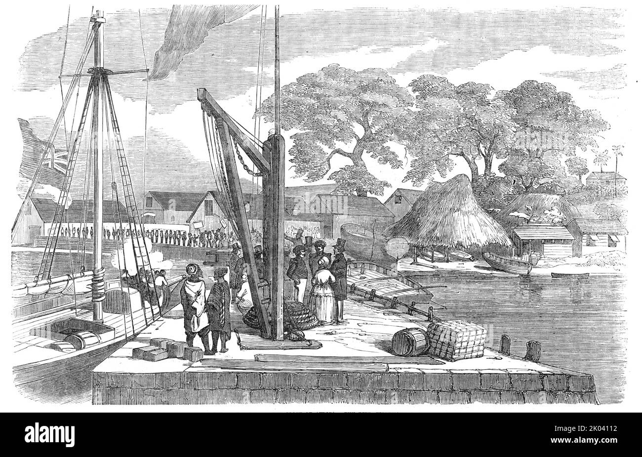Matacong, on the West Coast of Africa - the Pier, Warehouses, etc., 1854. Sketch accompanying an article on '...the progress in &quot;legitimate trade&quot; [at the island of Matakong off the coast of Guinea], and the great benefits which it cannot fail to confer upon the African race...Matacong (a corruption of Mata-can)...lies to the westward of the mouth of the Fouricariah river...Fish abound...and attract...fishermen from Sierra Leone...The silk cotton tree (Bombax Ceiba) grows here in great luxuriance...Here the African shows that secular and religious education has not been wholly thrown Stock Photo