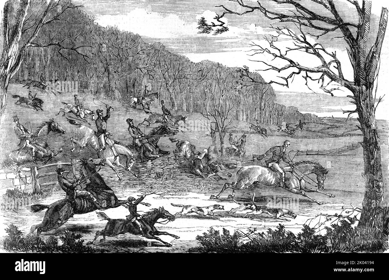Fox-hunting, 1854. '...an average provincial scene, with more sport and fun than fashion. We should say that Reynard has been dodging them round a big wood for an hour or two, until the whole field hasbecome thoroughly impatient; and, on the welcome sounds of &quot;Tallo-ho-away !&quot; a good many are dashing out of the cover and over the post and rails-the gate is locked-at a pace too good to last. The boy on the pony is making tremendous play, and means to go while he can. The young lady, on the other hand, has enjoyed the morning ride to cover, and the excitement and music of the find, and Stock Photo