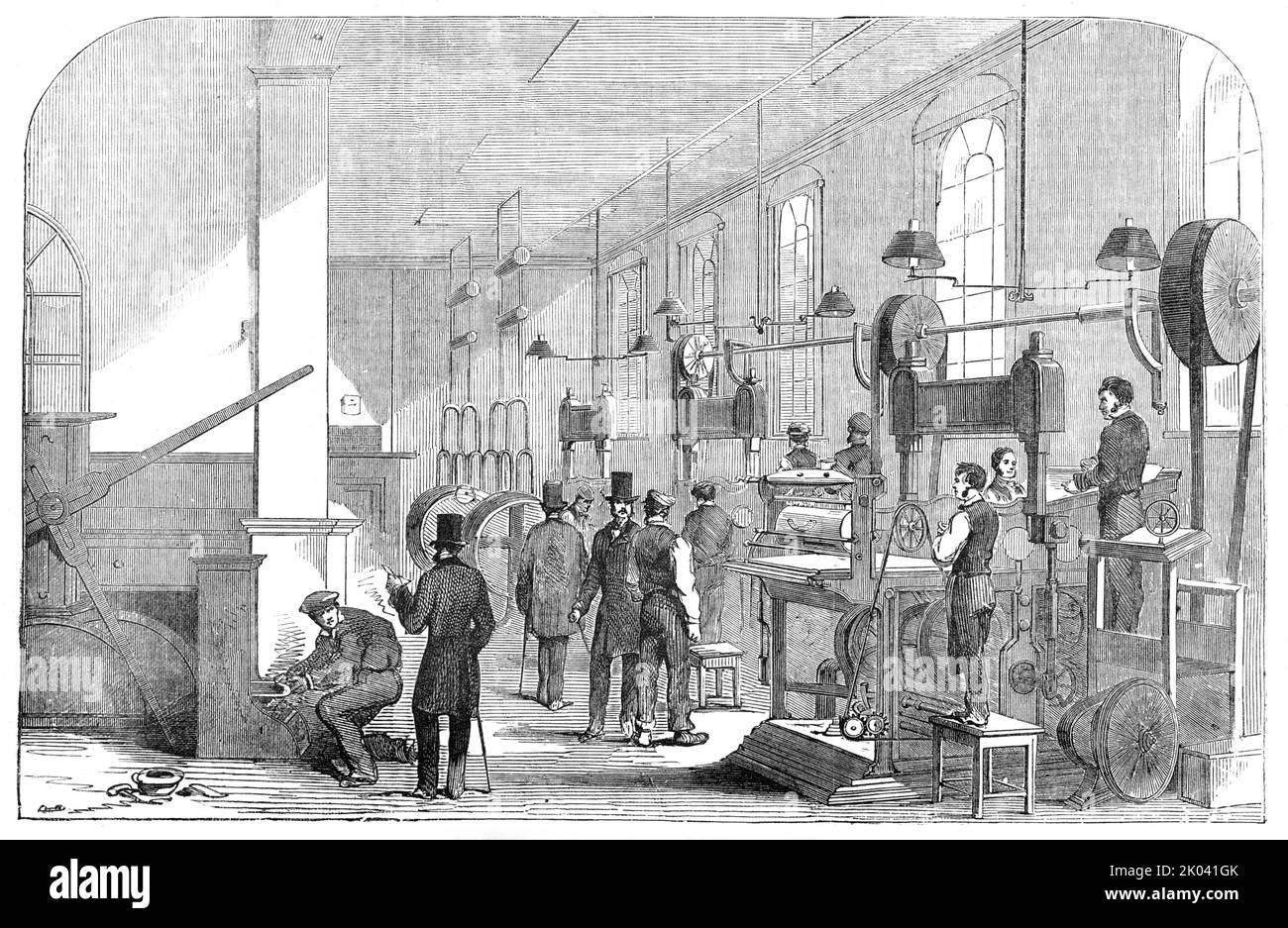 The Bank-Note Printing-Room, at the Bank of England [in London], 1854. 'The quality and the water-mark of the...paper have in the new Note (now on the point of being issued to the public) been brought to a high degree of excellence. The moulds from which the paper is made are executed by Mr. Brewer, who, with Mr. Smith, patented a very valuable invention, which was rewarded by a medal at the Great Exhibition of 1851...&quot;the Bank of England accepts no security which may not be possessed by any one who will make himself acquainted with the following characteristics of the paper and printing. Stock Photo