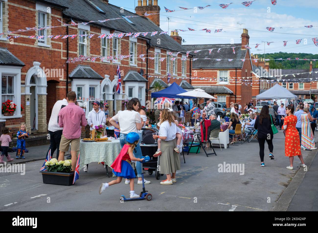 A street party held to celebrate the Platinum Jubilee of Her Majesty Queen Elizabeth II in the midst of Victorian terraced houses in Henley-on-Thames, Stock Photo