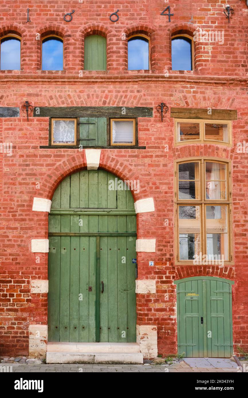 Old historic brick building marked 1664 on the front, former warehouse of Spiegelberg no. 48a, Old Town of Wismar, Mecklenburg, Germany. Stock Photo