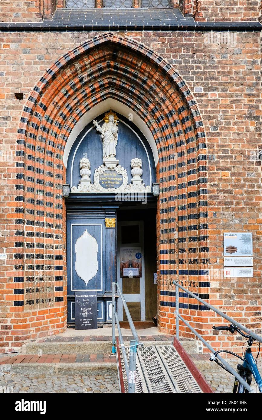 Gothic pointed arch portal, South side of the Nikolaikirche (Church of St. Nicholas), Old Town of the Hanseatic Town of Wismar, Germany. Stock Photo