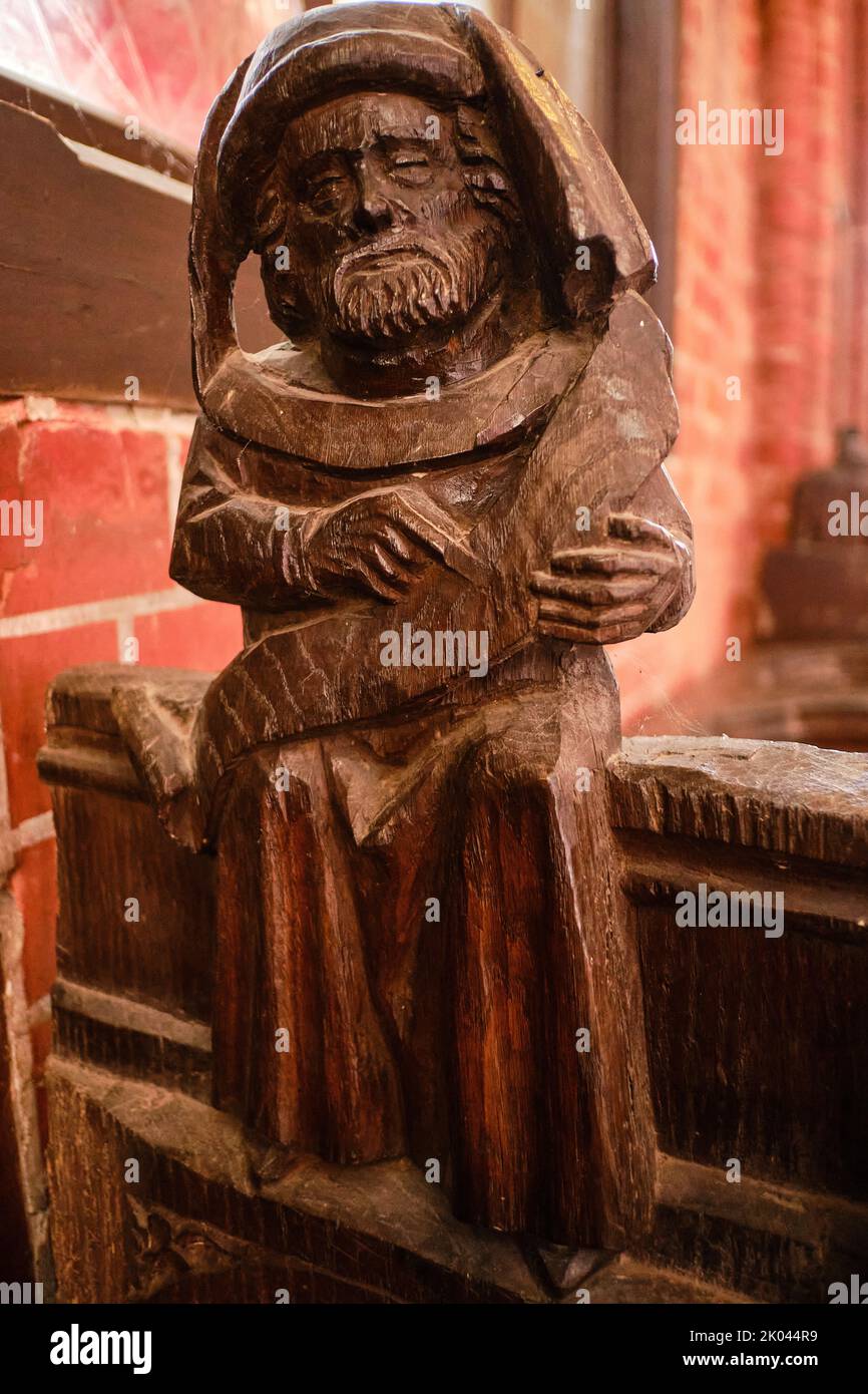 Carved wooden figures on Gothic choir stalls, Nikolaikirche (Church of St. Nicholas) Hanseatic Town of Wismar, Mecklenburg-Western Pomerania, Germany. Stock Photo