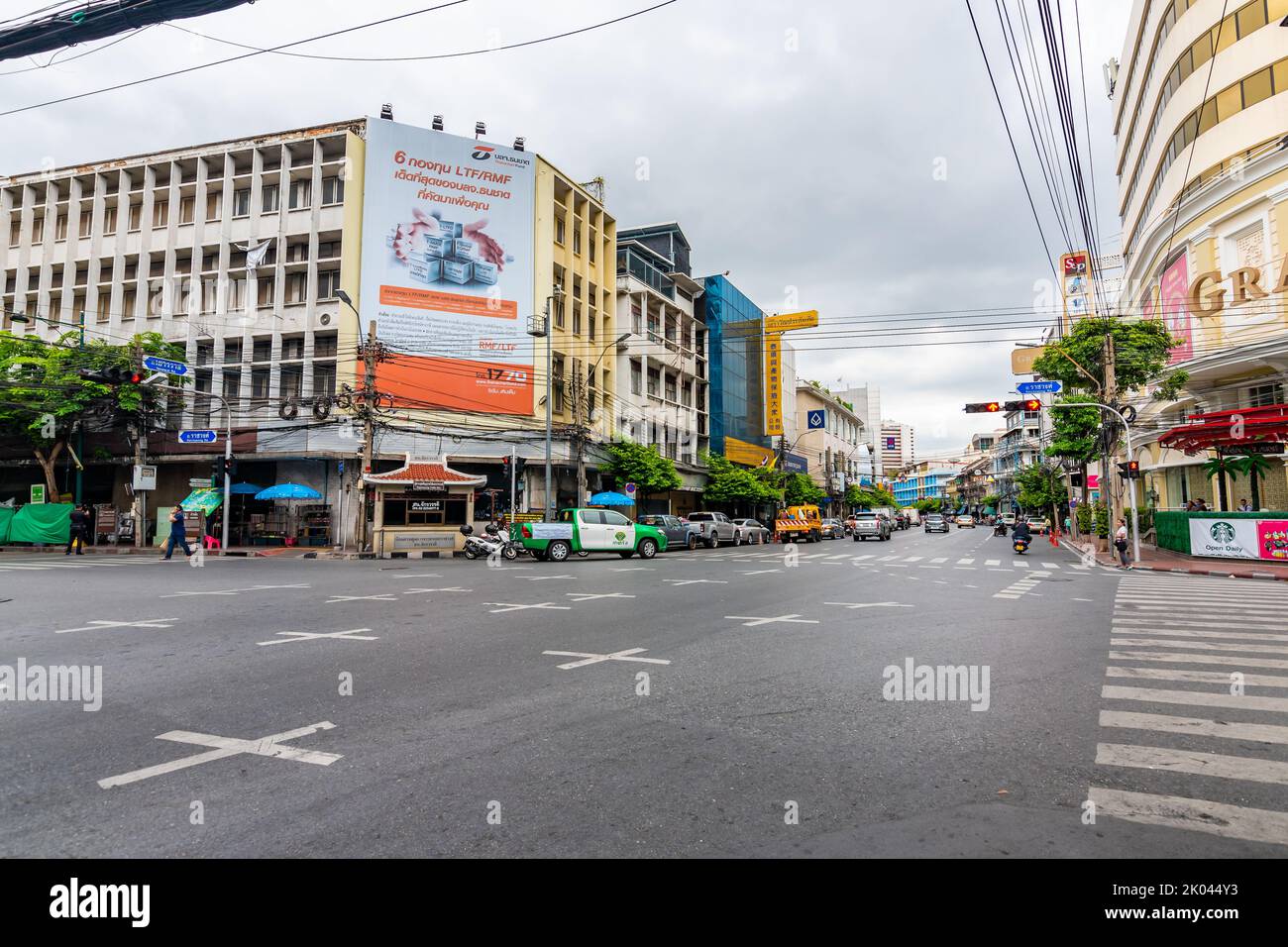BANGKOK, THAILAND - 1.11.2019: Streets in the China town, Bangkok city. Traffic on street with the market on side. Heavy transportation, cars and moto Stock Photo