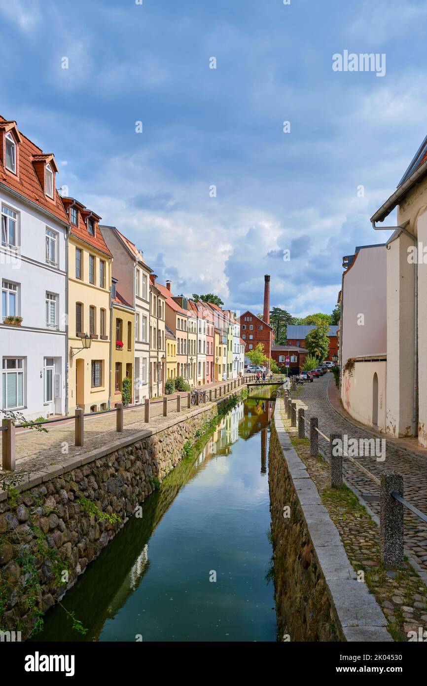 View along the Mühlengrube brook of the Old Town backdrop in the Nikolaiviertel (Nicholas Quarter), Hanseatic Town of Wismar, Germany. Stock Photo