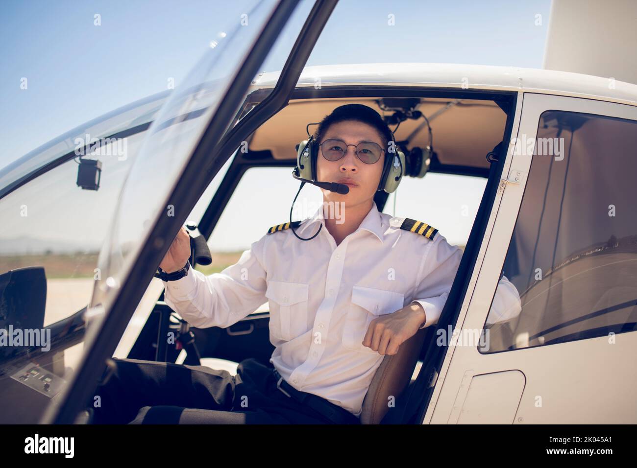 Chinese pilot sitting in helicopter cockpit Stock Photo Alamy Chinese pilot sitting in helicopter cockpit Stock Photo Alamy