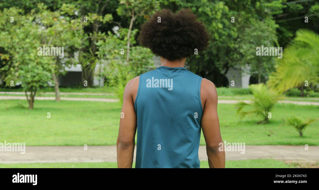 Back of african black man walking at park outdoors Stock Photo - Alamy