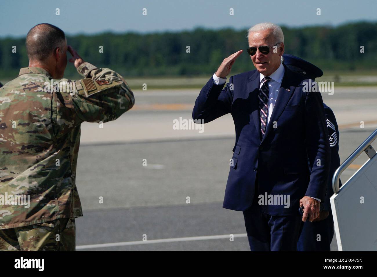 U.S. President Joe Biden salutes as he descends from Air Force One at Dover Air Force Base in Dover, Delaware, U.S. September 9, 2022. REUTERS/Joshua Roberts Stock Photo