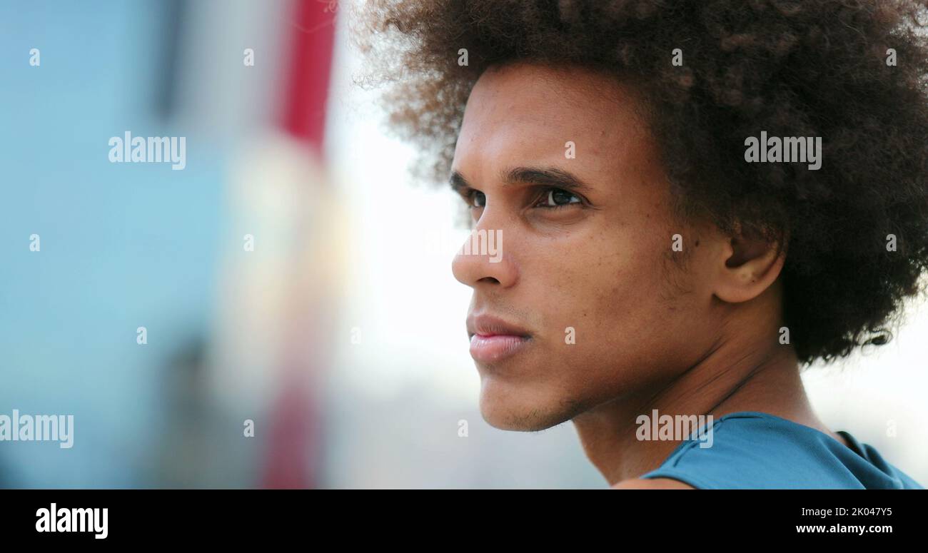 Contemplative thinking mixed race young man thoughtful Stock Photo - Alamy