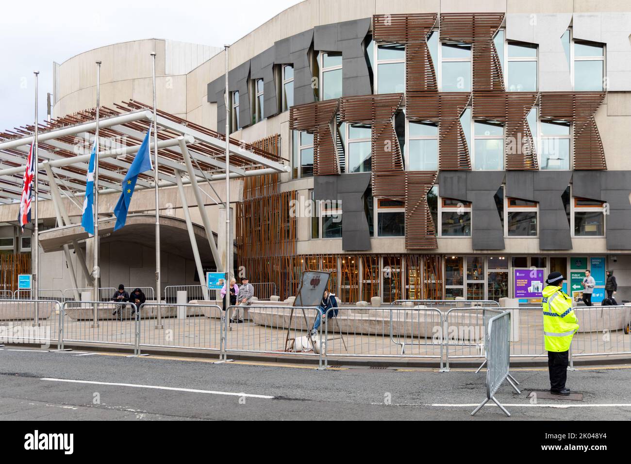 The Scottish Parliament building in Edinburgh with flags at half mast