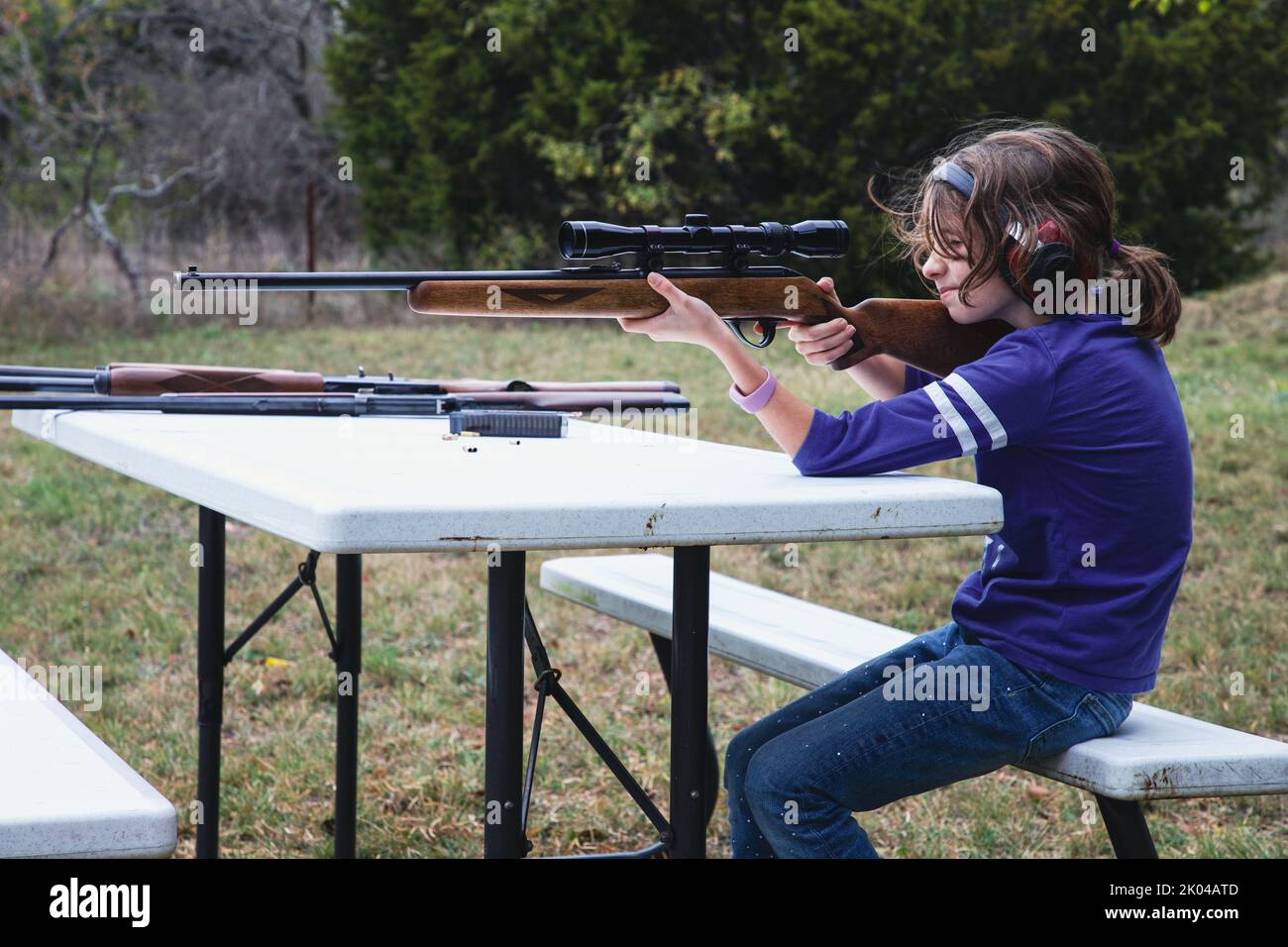 Child shooting a rifle Stock Photo