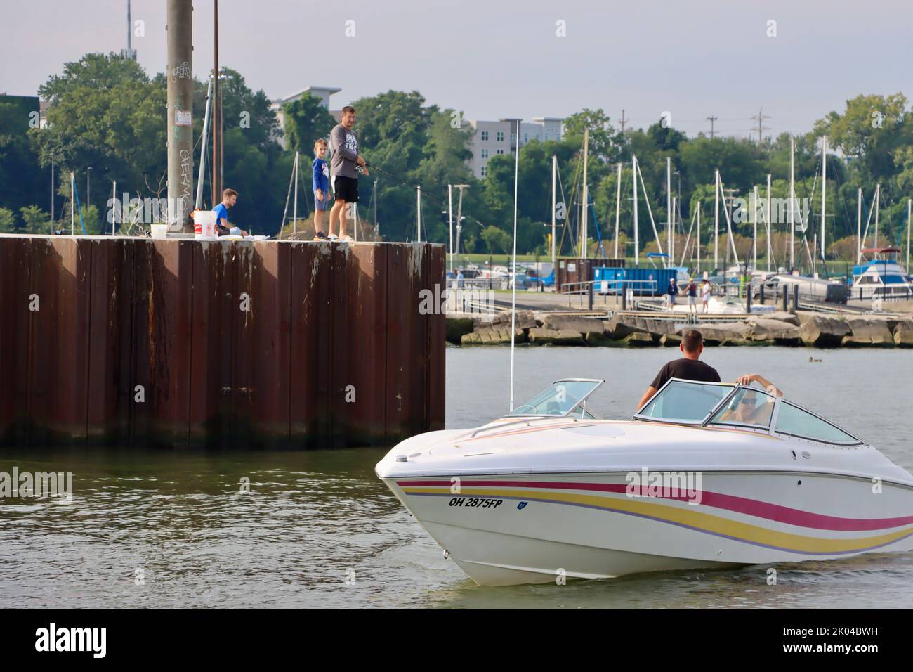 A speed boat at the pier of Cleveland historic coast guard station in Cleveland harbor. Stock Photo