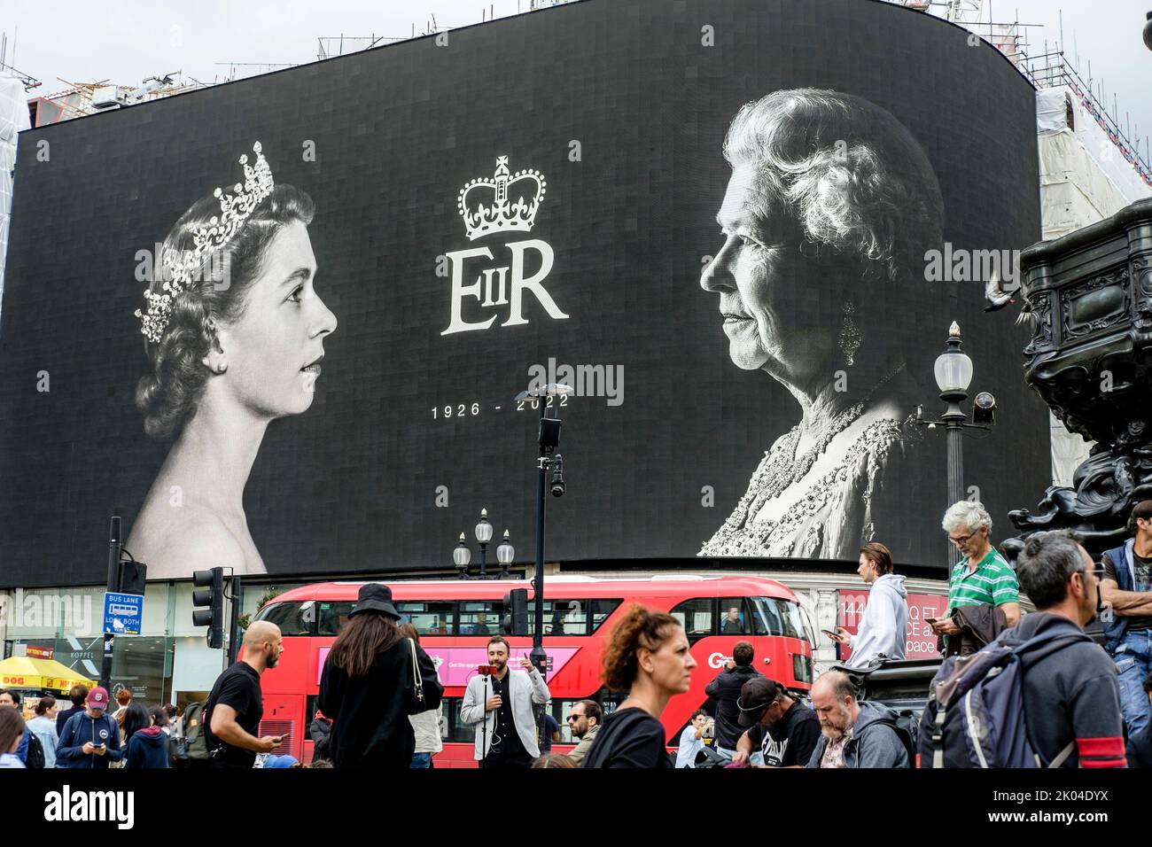 London, UK. 9th September 2022. Images of Queen Elizabeth II  displayed on screens at Piccadilly Circus in tribute to Her Majesty following her death on 8th September 2022. Stock Photo