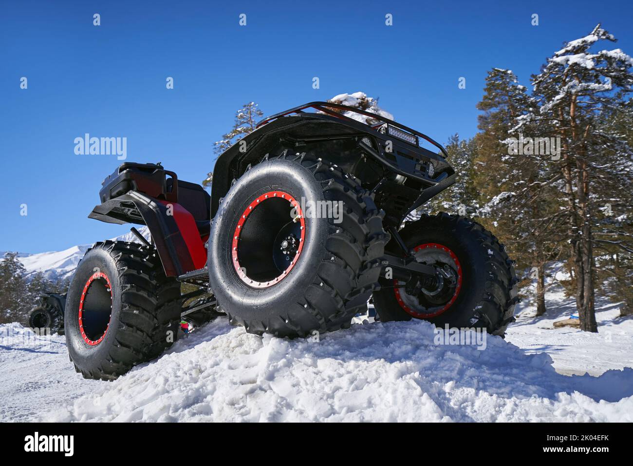 ATV with big wheels on the snow. Stock Photo