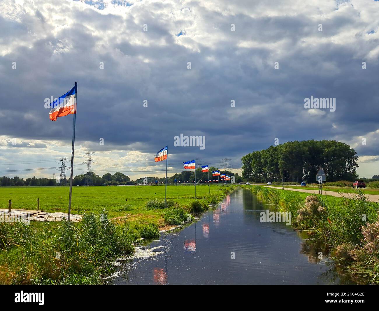 Flag upside down as farmers protest against government measures for nitrogen deposition in Lekkerkerk, the Netherlands in 2022 Stock Photo