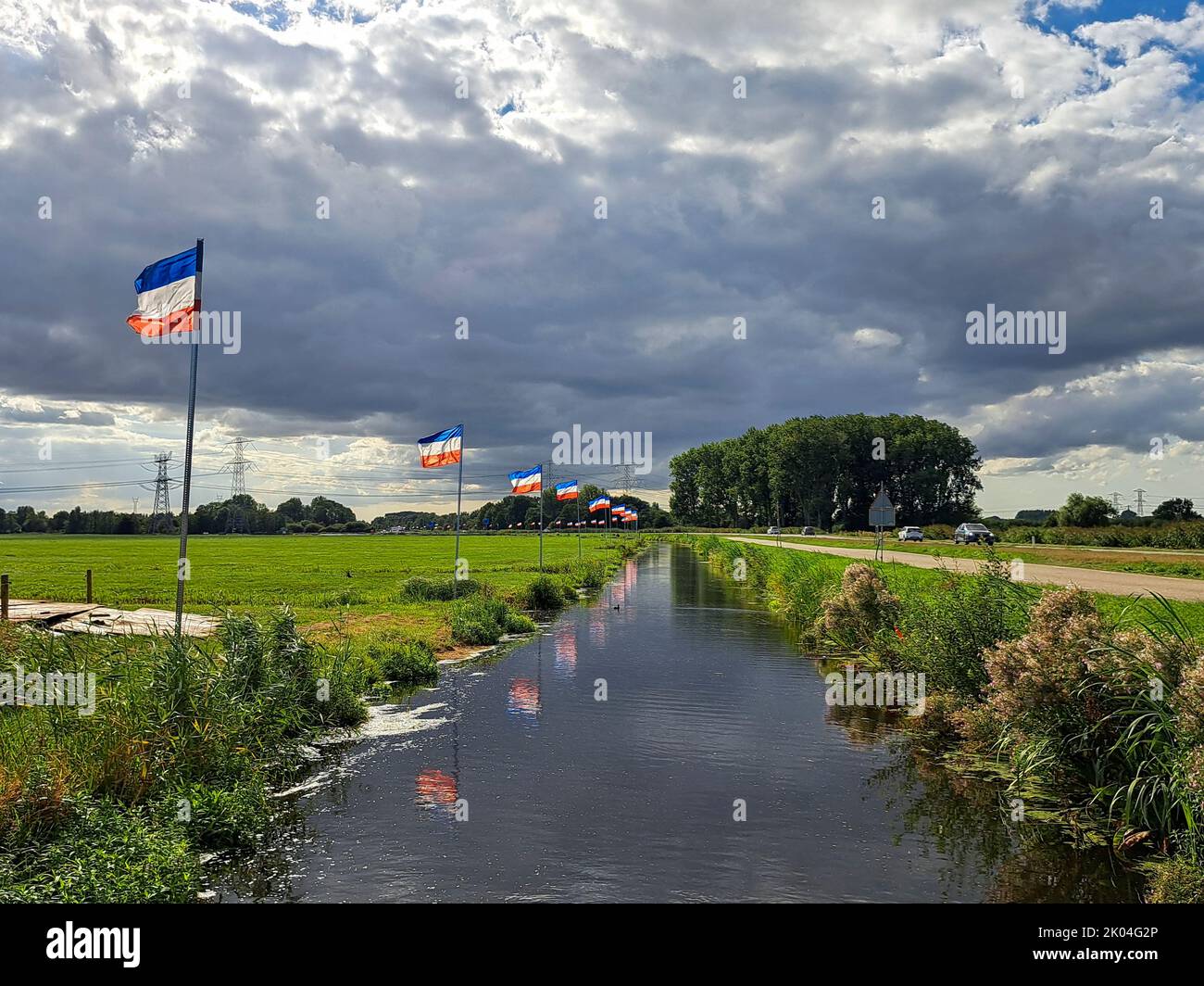 Flag upside down as farmers protest against government measures for nitrogen deposition in Lekkerkerk, the Netherlands in 2022 Stock Photo
