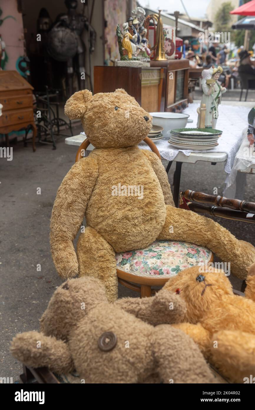 Haifa, Israel - June 30, 2022, Teddy bear in a chair at a flea market Stock Photo