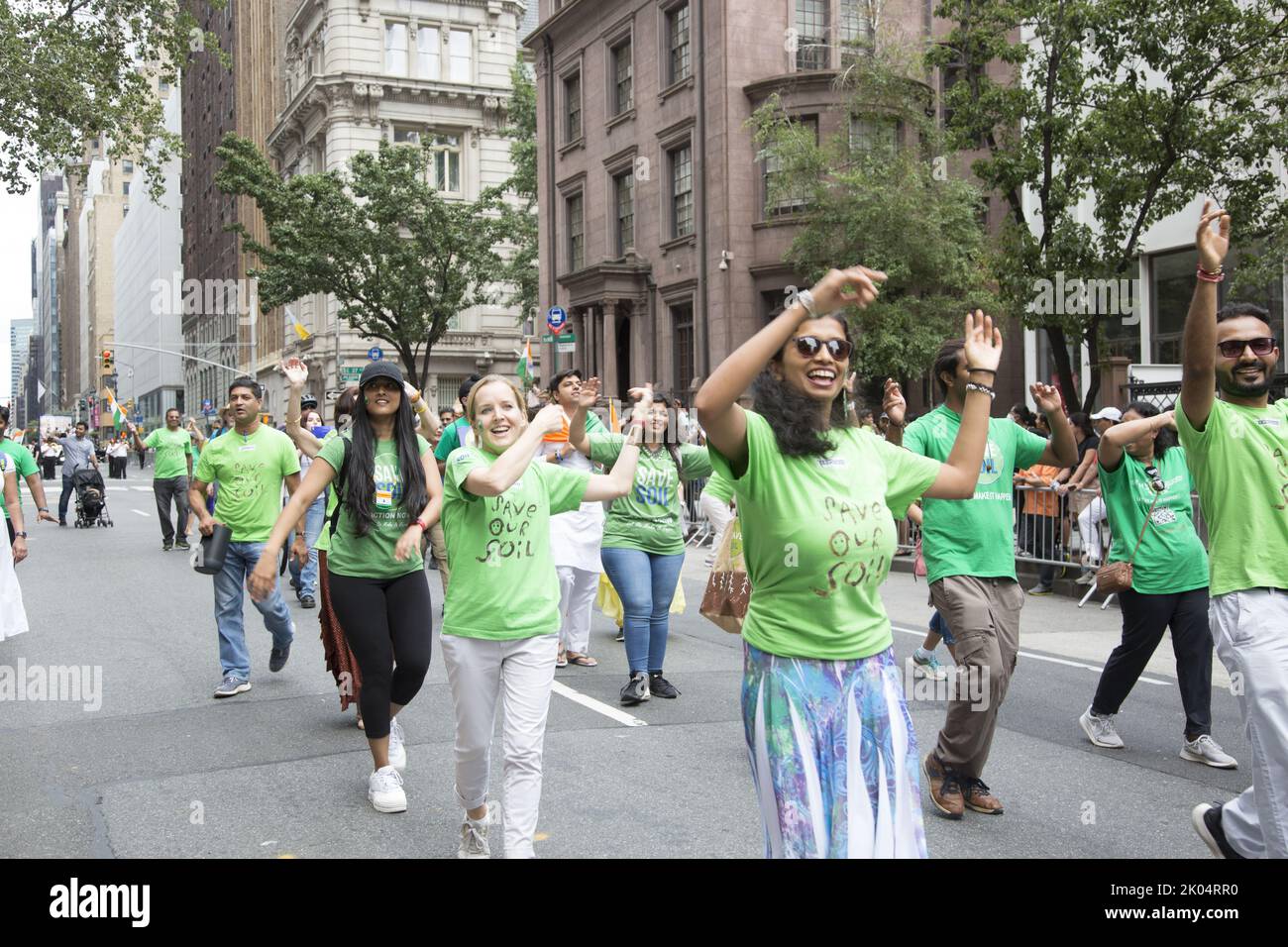 75th anniversary Indian Independence Day Parade on Madison Avenue in New York City. Members of Save Soil environmental movement dance in the pasrade.     Save Soil is a global movement launched by Sadhguru, to address the soil crisis by bringing together people from around the world to stand up for Soil Health, and supporting leaders of all nations to institute national policies and actions toward increasing the organic content in cultivable Soil. Stock Photo