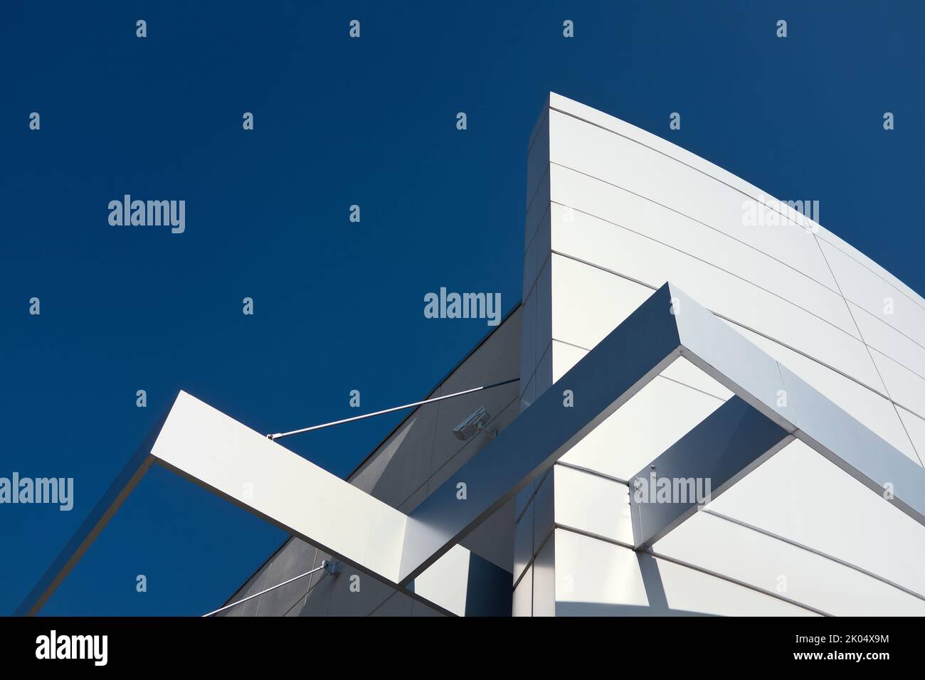 Low Angle View of Building Exterior Detail against Blue Sky Stock Photo