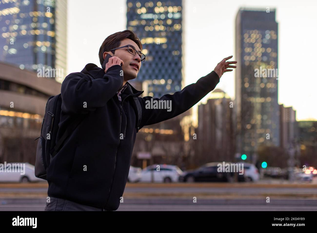 Chinese IT worker talking on cell phone Stock Photo