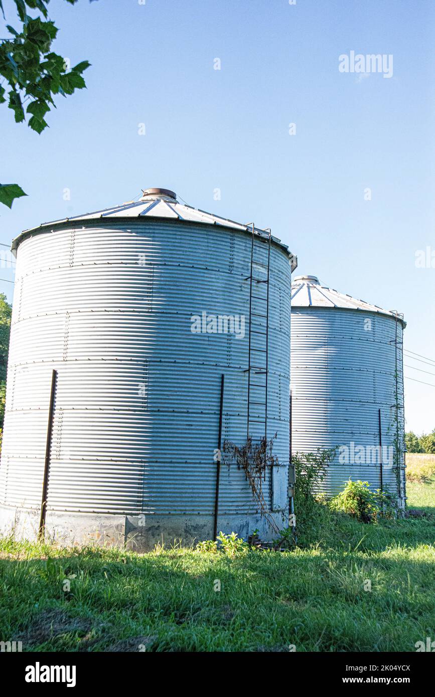 Two old grain bins on a farm Stock Photo Alamy
