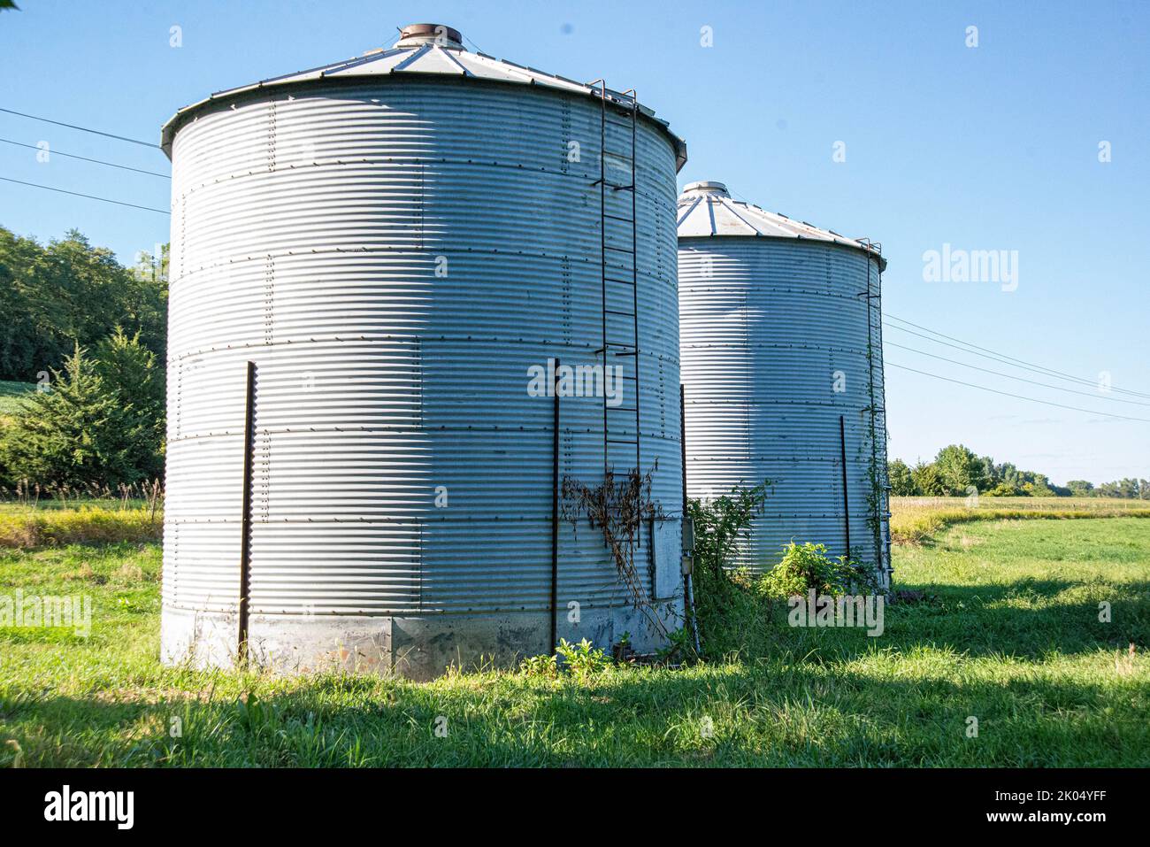 Two old grain bins on a farm Stock Photo Alamy
